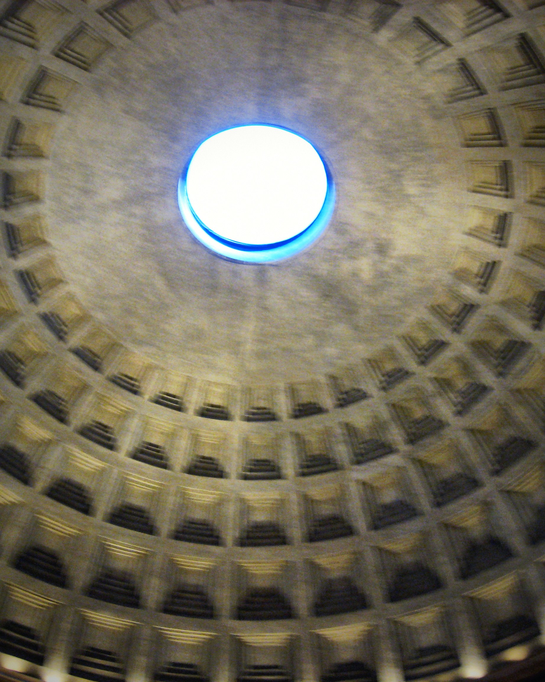 The round oculus at the top of the Pantheon's coffered dome, open to the sky.