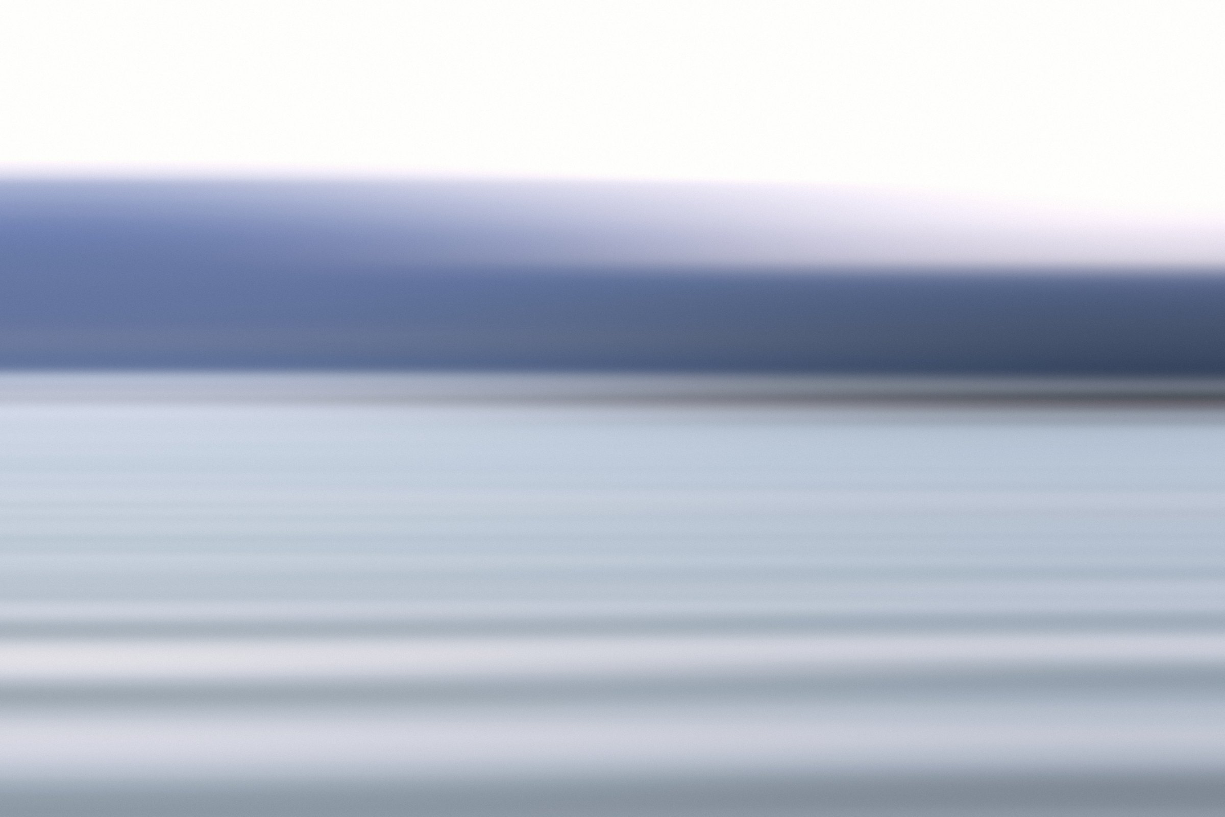 Soft horizontal bands of pewter grey, white and pale blue.
