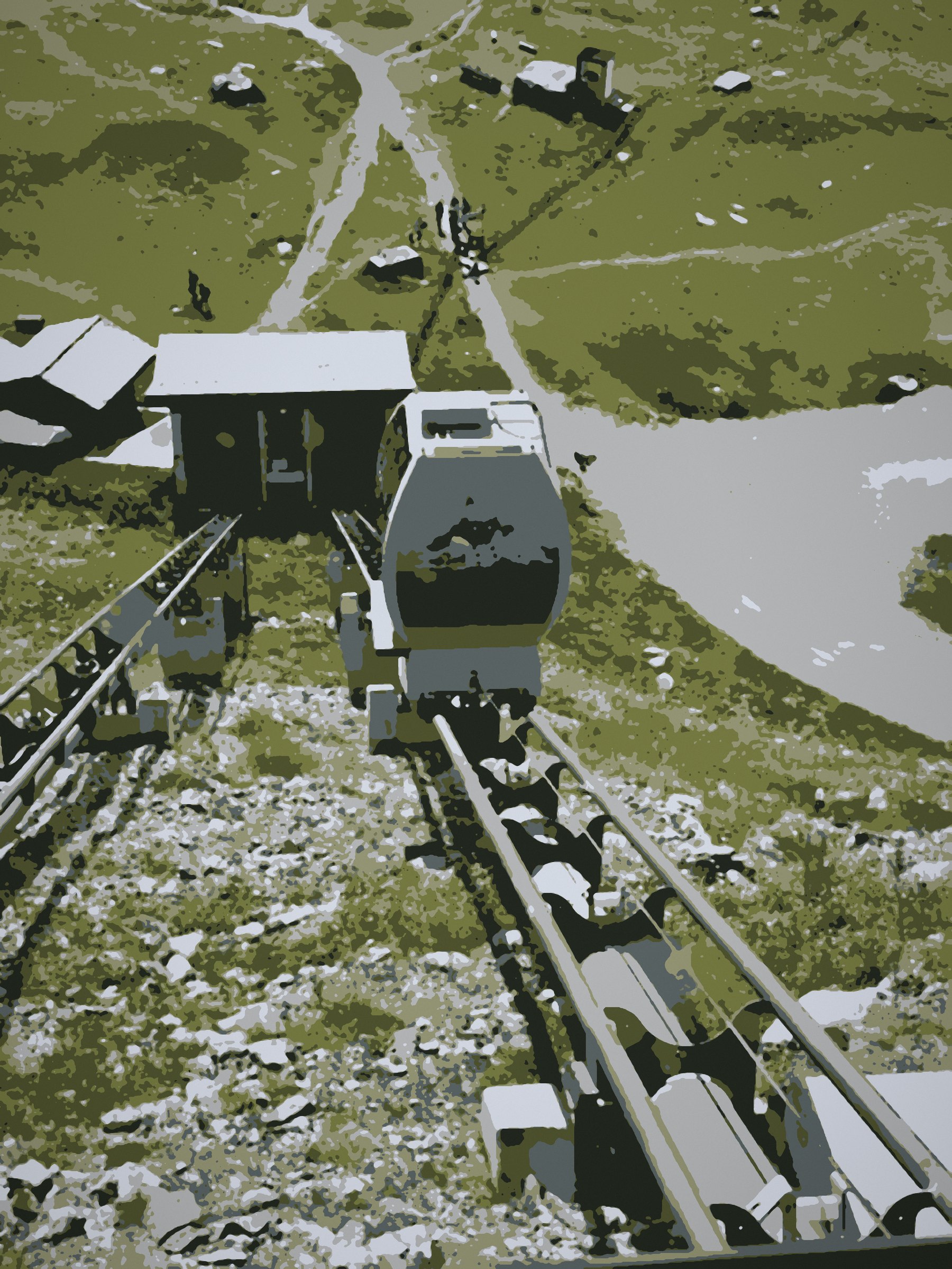 Posterized view down on a rack train winding through a green mountain slope.