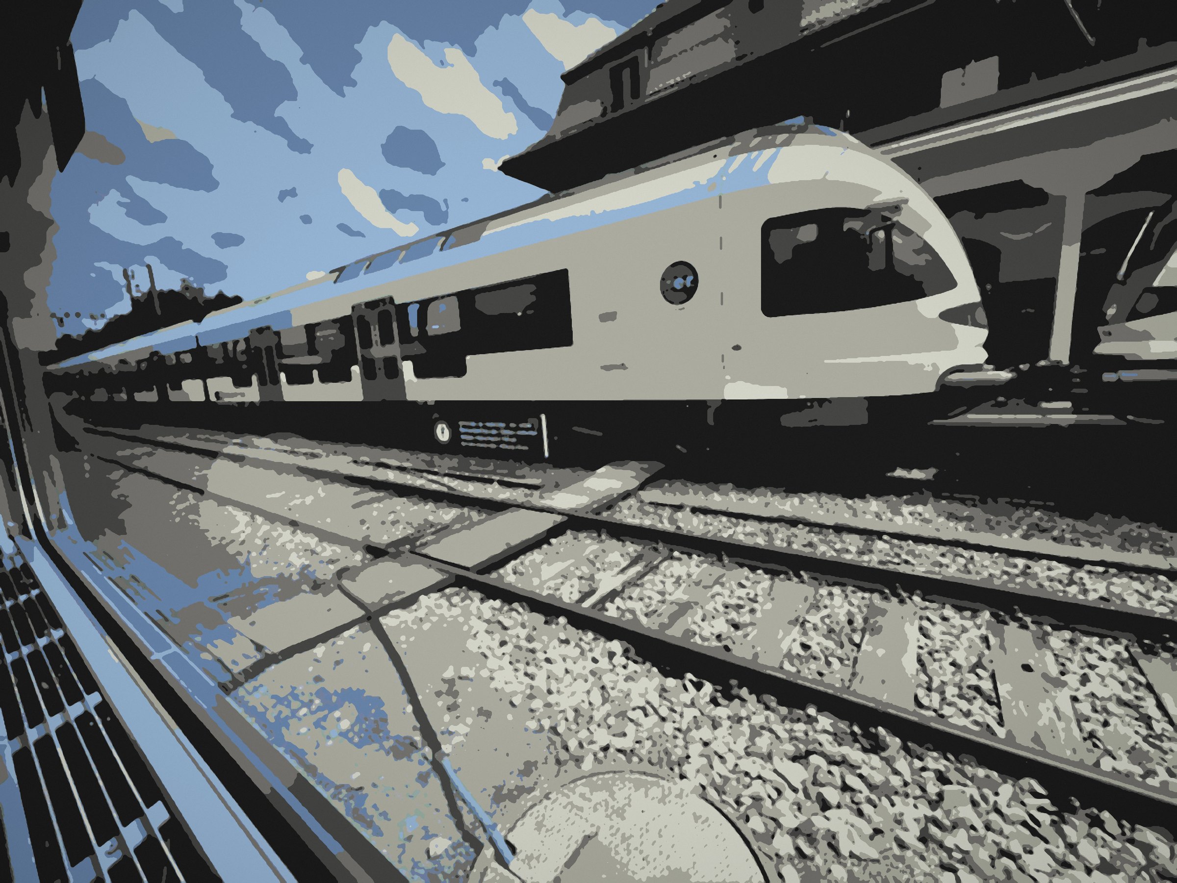 Posterized high-speed train in blue and white racing past a station in France.