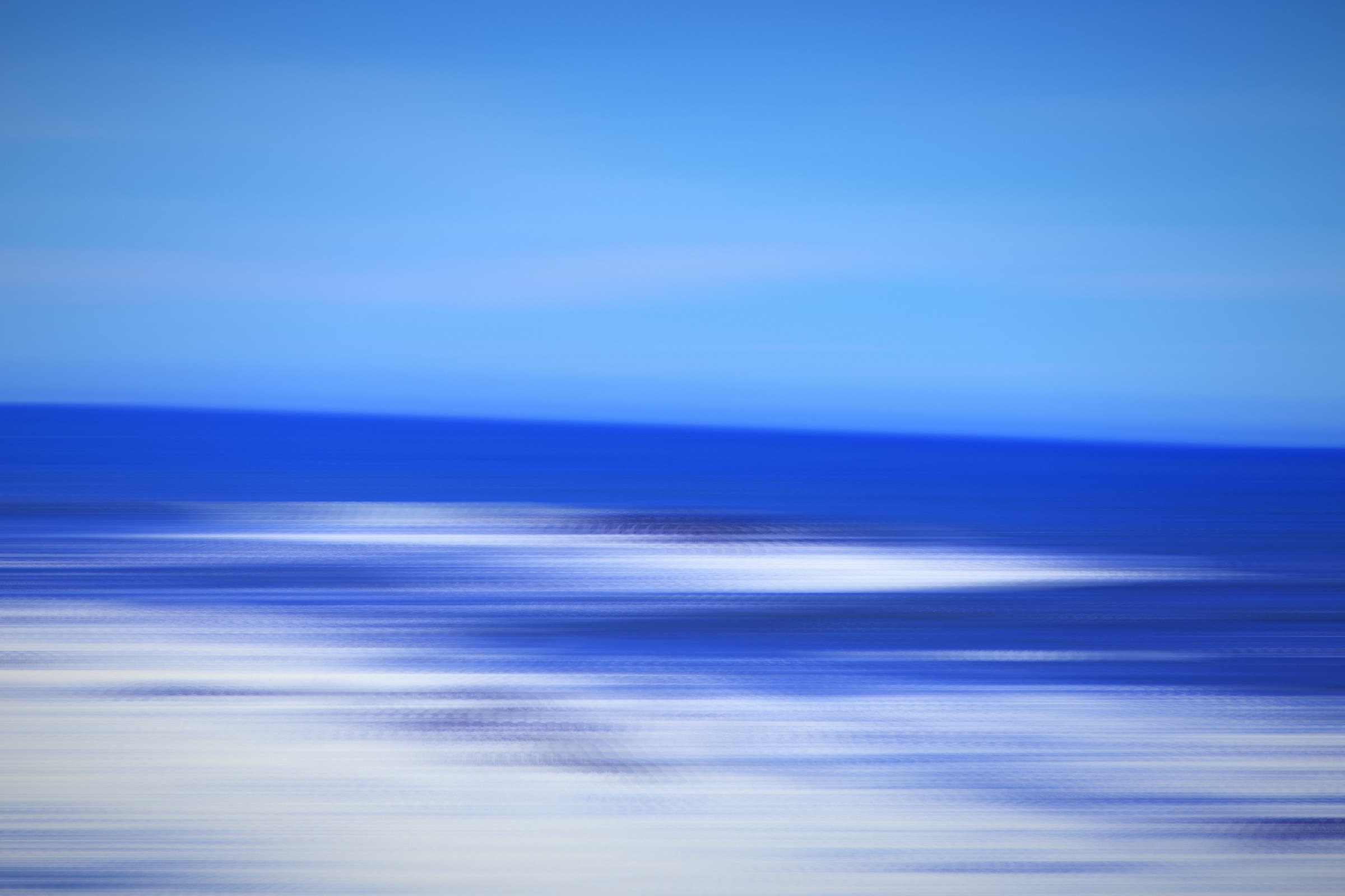 Bright blue bands with white surf streaking across.