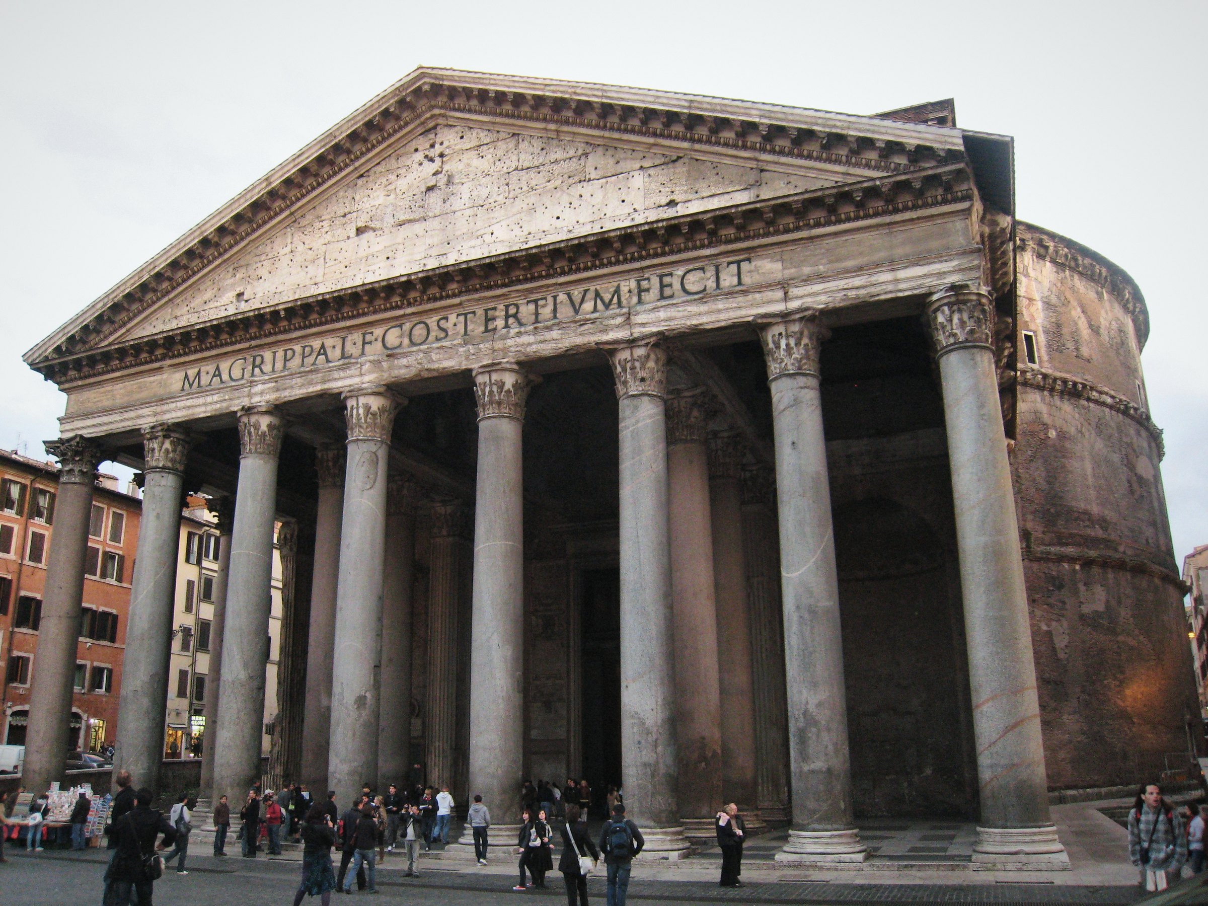The columned portico and pediment of the Pantheon with people below.