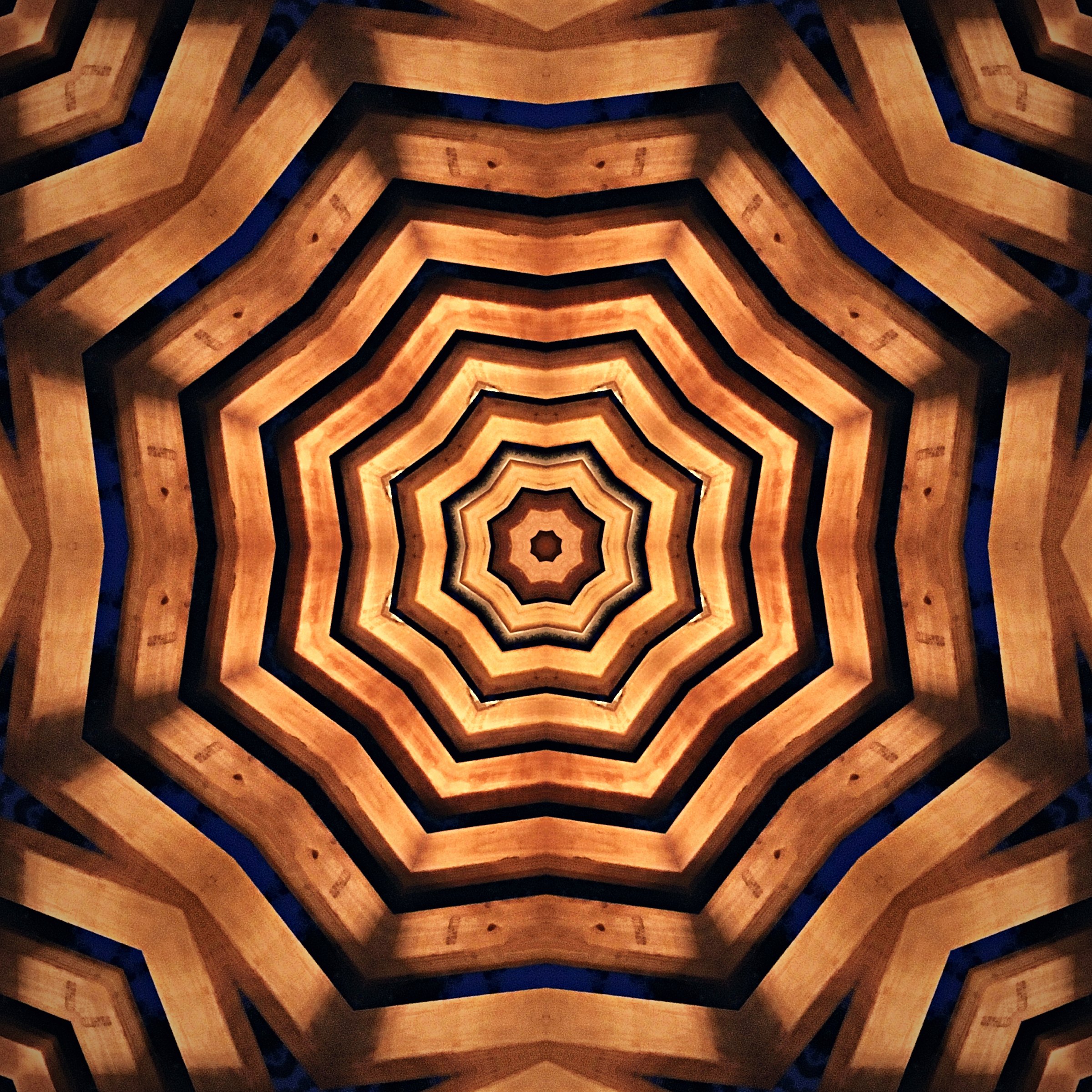 Concentric rings of copper and dark brown forming a heptagon tunnel.