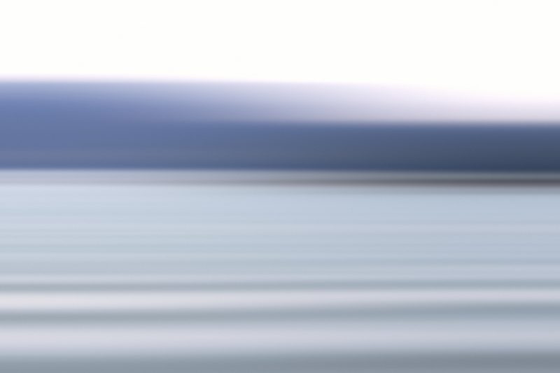 Soft horizontal bands of pewter grey, white and pale blue.