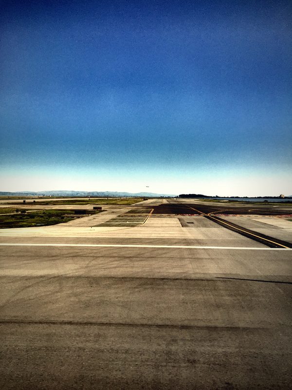 Long runway markings stretching across flat ground toward a distant horizon.
