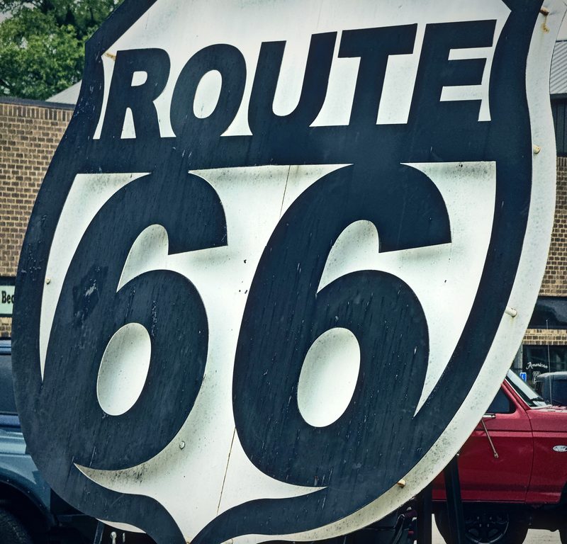 Huge black and white Route 66 shield sign.