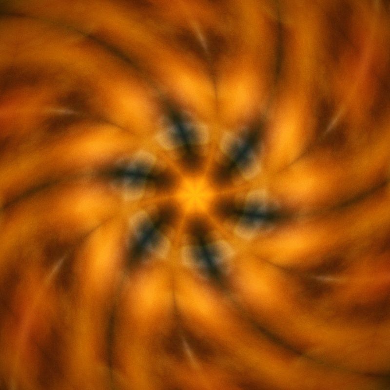 Swirling orange and amber kaleidoscope of autumn leaves.