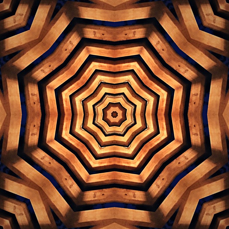 Concentric rings of copper and dark brown forming a heptagon tunnel.
